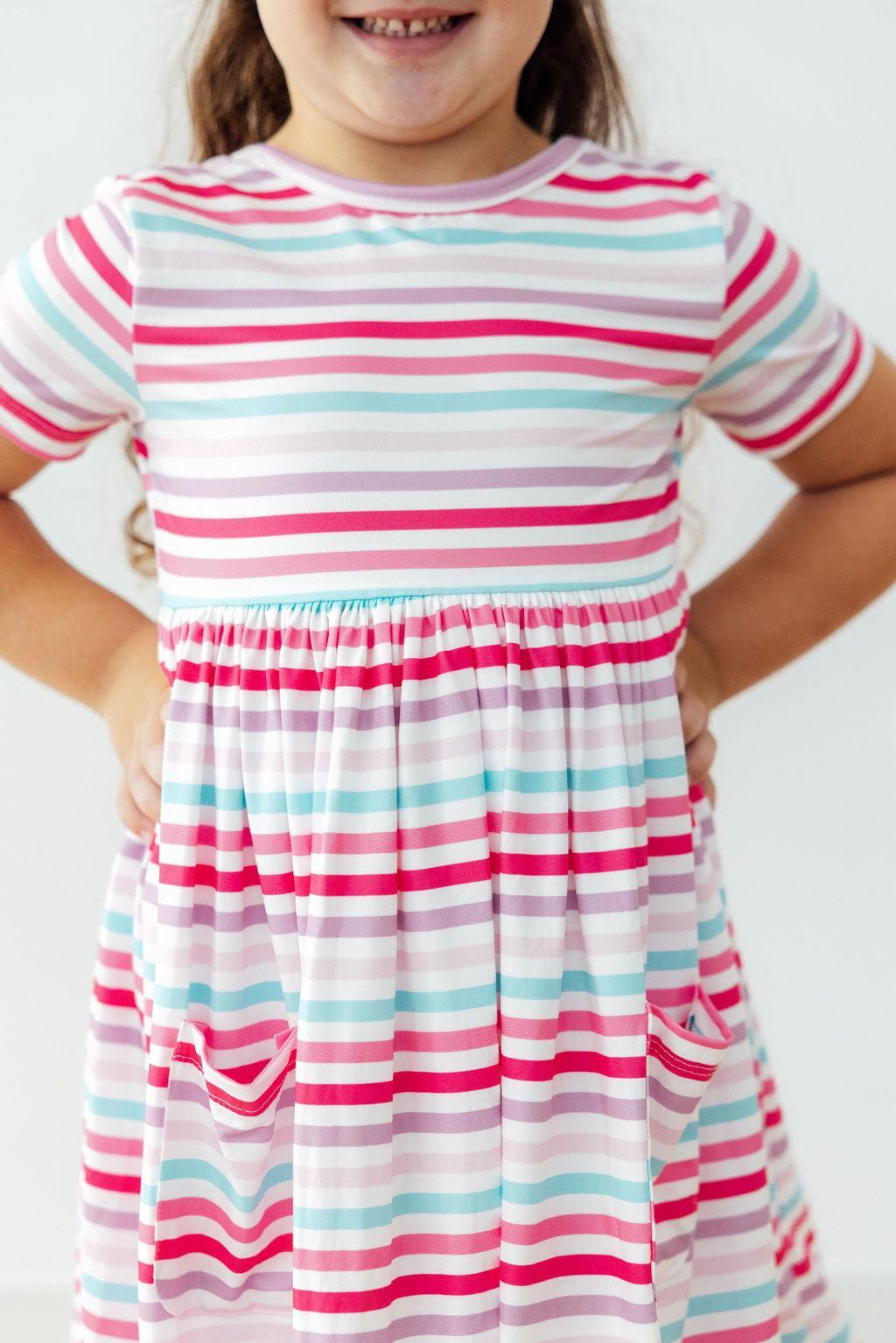 Pastel Stripes Short Sleeve Twirl Dress for Girls styled with accessories, a versatile girls twirl dress for various occasions.