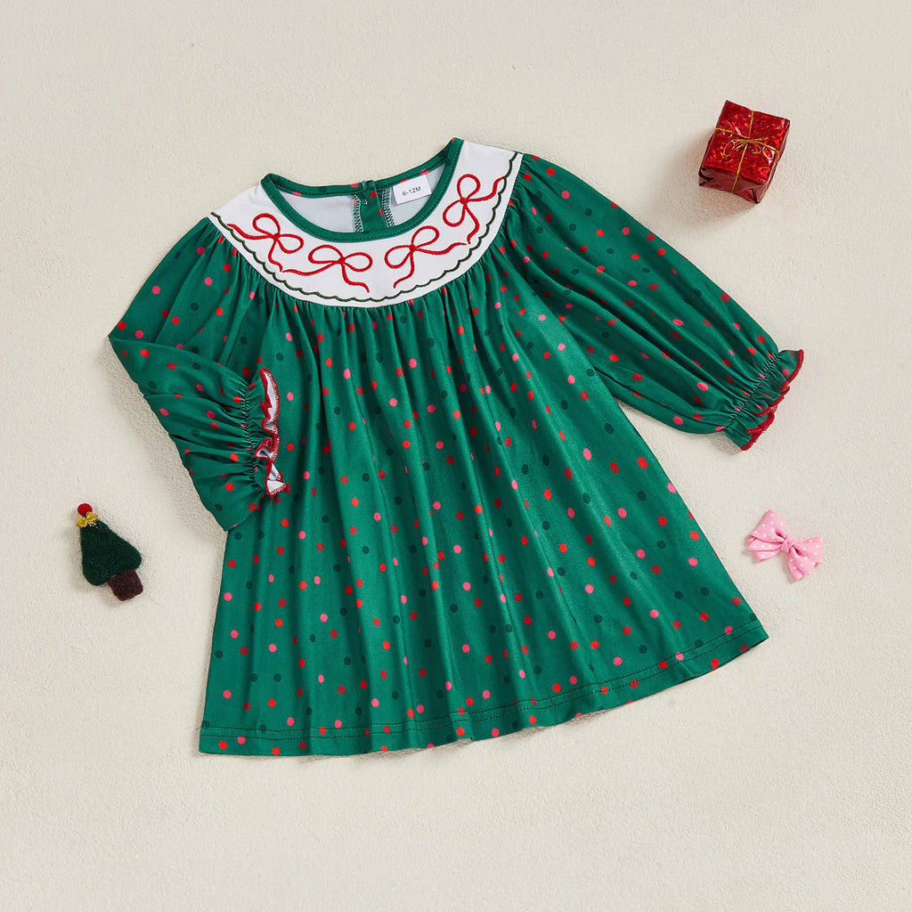 Polka Dots and Bows Fall Dress - Evergreen displayed flat on a beige background, featuring a vibrant green color with playful polka dots and decorative red bows, ideal for girls aged 6-12 months to 3-4 years.