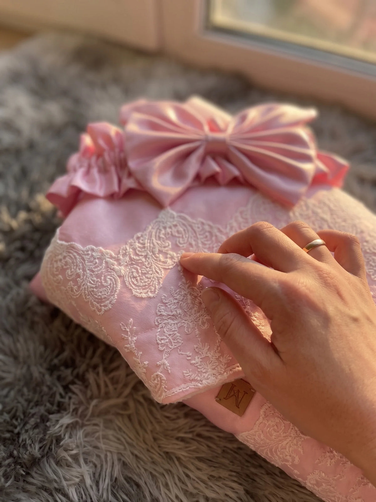 Palm Beach pink satin baby receiving blanket 80x80 cm with lace trim, envelope design, large bow and ruffles.