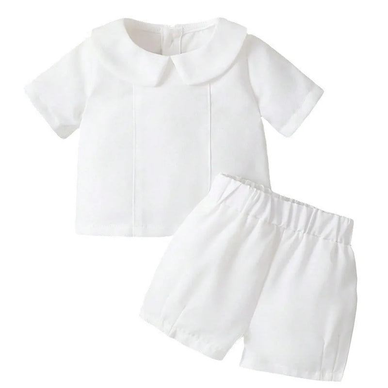White 2-piece boys baptism outfit with turn-down Peter Pan collar short-sleeve top and elastic waist shorts, combed cotton.