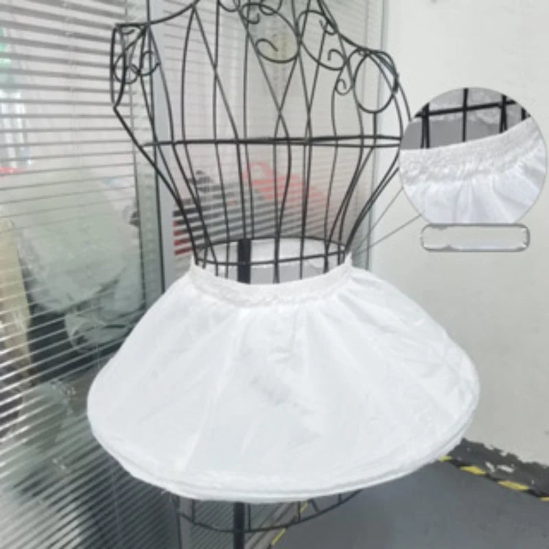 Girl's adjustable off-white short crinoline underskirt on a dress form; elastic waist, lightweight polyester.