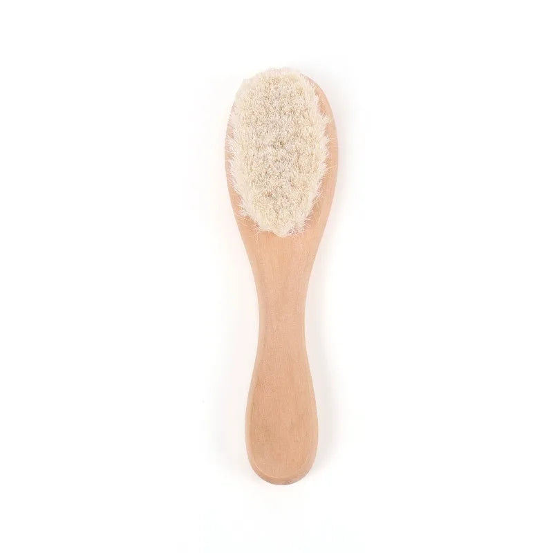 Wooden baby/toddler brush with soft bristles and rounded handle.