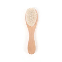 Wooden baby/toddler brush with soft bristles and rounded handle.