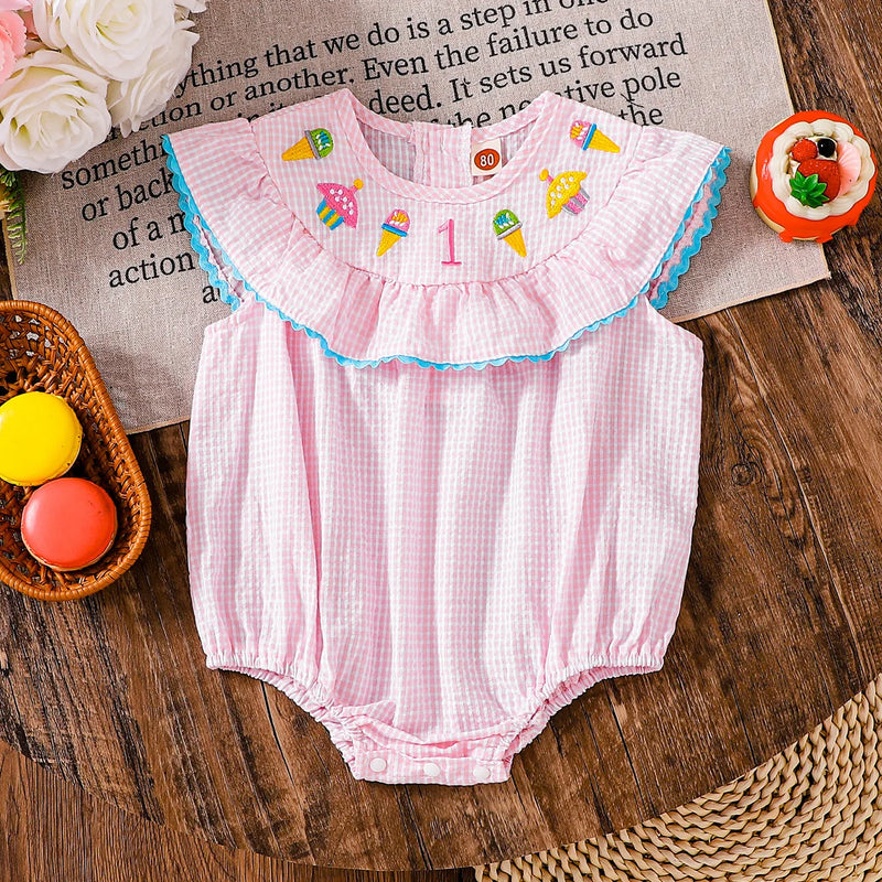 Another view of the Birthday Girl Romper displaying colorful ice cream and cupcake embroidery, ideal for celebrating little girls' birthdays.