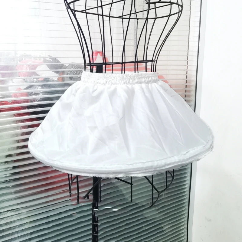 Girl's adjustable off-white short crinoline petticoat underskirt with elastic waistband on a dress form.