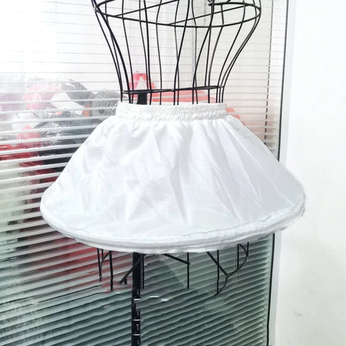 Girl's adjustable off-white short crinoline petticoat underskirt with elastic waistband on a dress form.