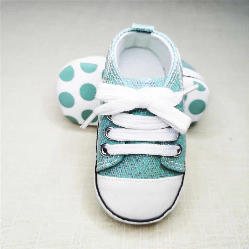 Baby's Canvas Lace-up First Walkers in Shimmering Aqua Green, perfect for toddlers taking their first steps, featuring a durable cork sole and secure lace-up closure.