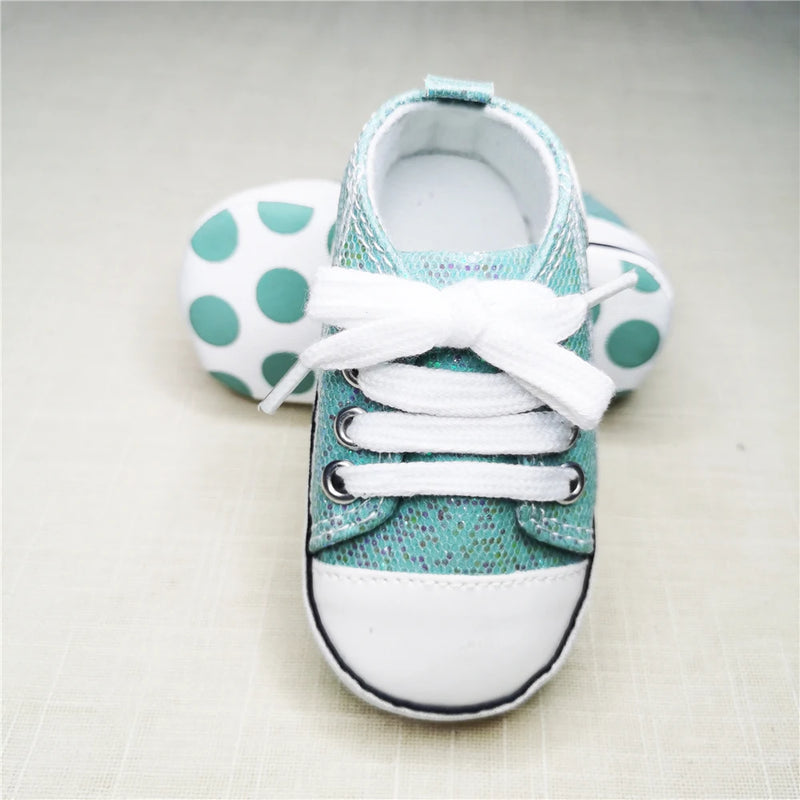 Baby's Canvas Lace-up First Walkers in Shimmering Aqua Green, perfect for toddlers taking their first steps, featuring a durable cork sole and secure lace-up closure.