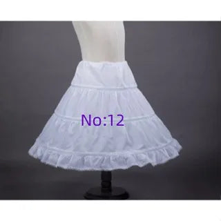 White children's petticoat crinoline underskirt on mannequin, multi-tier ruffled layers, 6 styles.