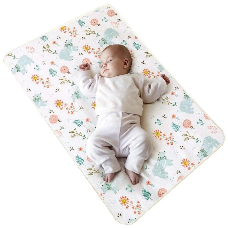 Baby on a waterproof cotton changing pad with cute prints; 50x70 or 70x90 cm, suitable for newborns to 4-6y.