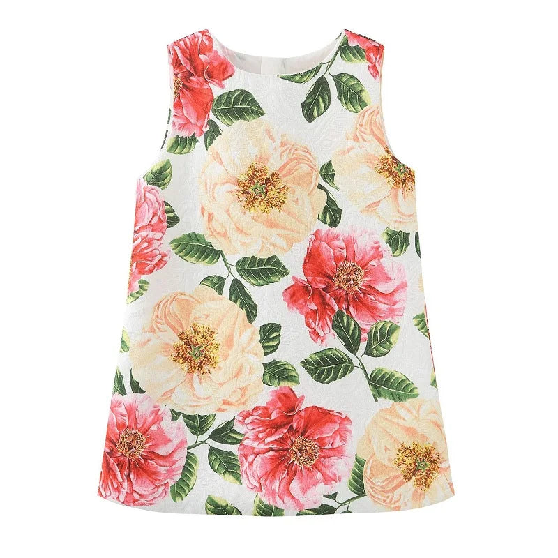 'Summer Fleurs' Little Girls Party Dress displayed with a cheerful floral design featuring large pink and peach flowers on a bright background, ideal for twirling at parties.