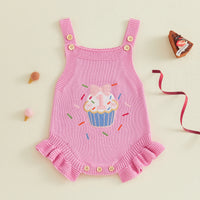 Pink knitted romper overalls for baby girl with cupcake applique and button straps