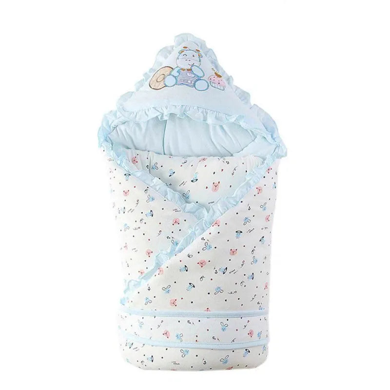 Charming light blue 'Animal Cutie' baby swaddle wrap featuring playful animal prints, designed for warmth and comfort.
