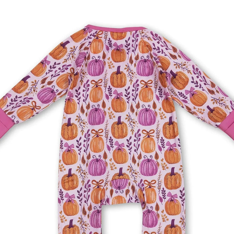 Close-up of the back of the 'Pumpkins and Flowers' romper zippered front, showcasing colorful pumpkin and floral patterns.