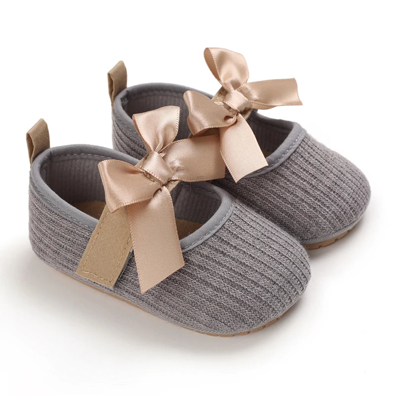 Baby Jane Satin Bow Baby Shoes in gray, crafted with a soft texture and a cute satin bow for infants.