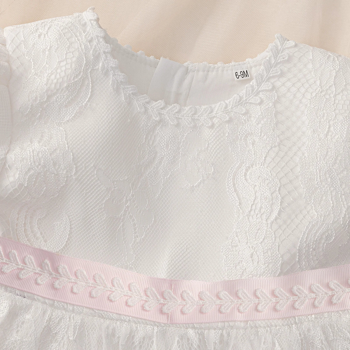 White lace Tabitha Elegant Baptism Flower Girl Dress with pink waist accent, back zipper, knee-length, 6-9M tag