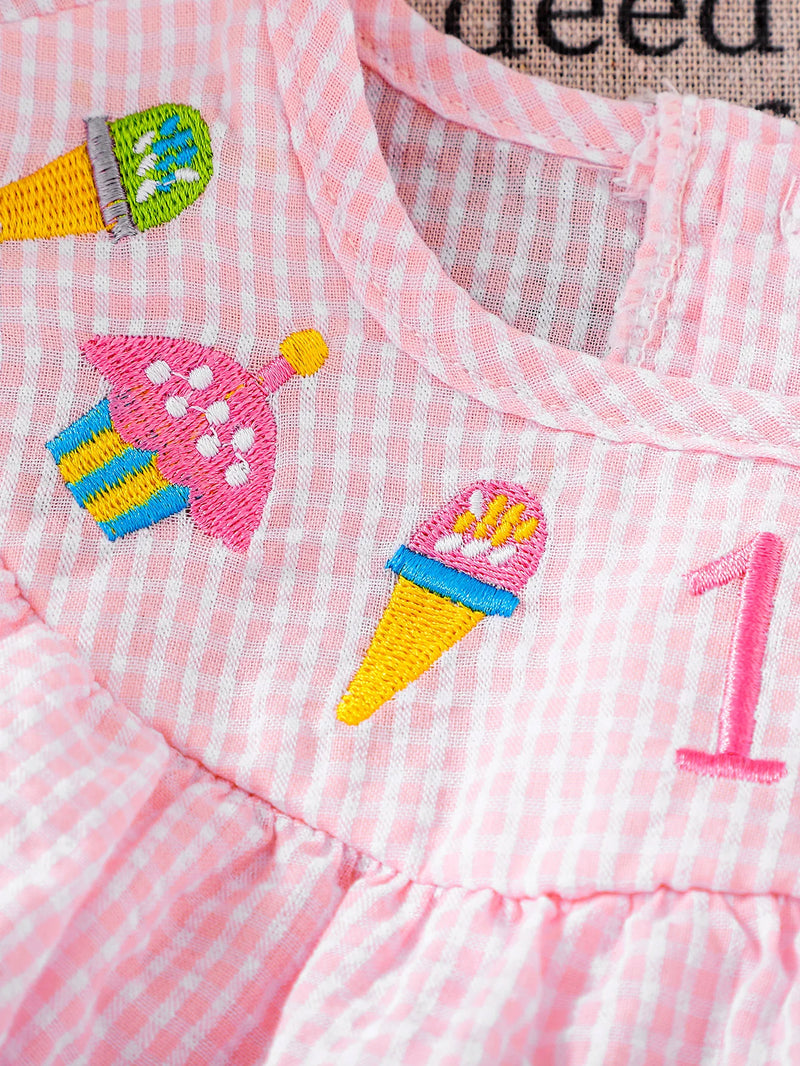 Close-up of birthday-themed embroidery on the Birthday Girl Romper, showcasing cupcakes and ice cream designs, perfect for birthday parties.