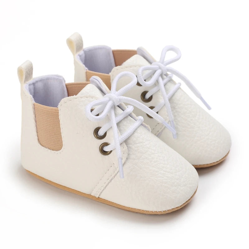 Retro-Baby Rubber Soled Lace-ups in white with lace closure, perfect for stylish infants aged 0 to 18 months.