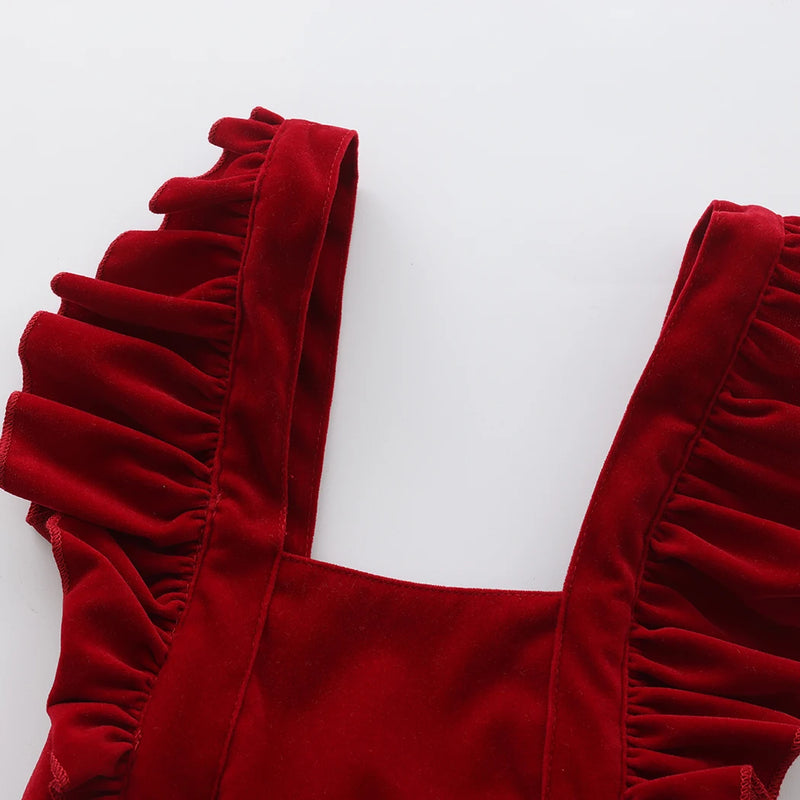 Close-up of the frilly straps of the Little Sofie Velvet Frilly Bubble, emphasizing the plush velvet texture that adds elegance to this charming frilly bubble romper.
