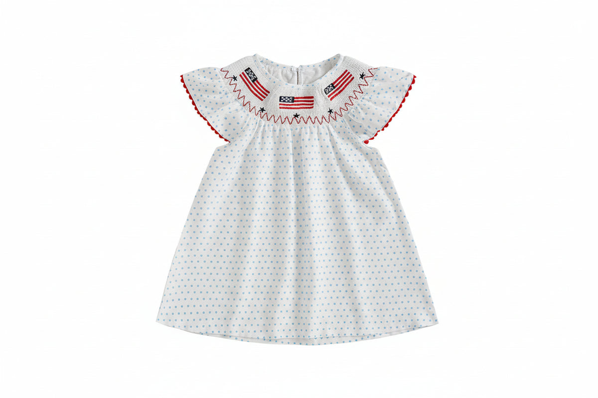 White dress with red and blue details on a beige background