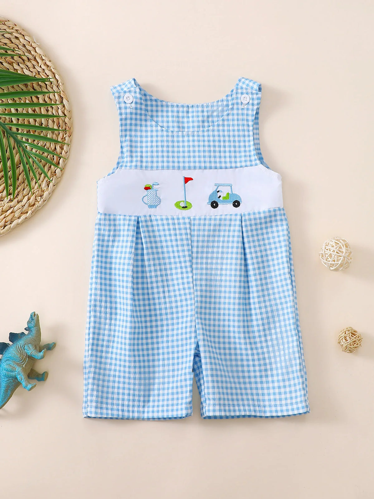 Blue and white check sleeveless baby romper with golf-themed embroidery, button closure, and round neckline for toddlers.
