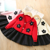 Vanessa floral knitted cardigan and pleated skirt two-piece set in red, pink, cream with black flower appliques