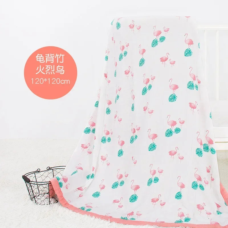 Two-layer bamboo-cotton baby swaddle blanket with pink flamingos and teal leaves, 120x120 cm.