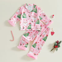 Girls pink satin Christmas pajama set featuring Santa, trees, and bows with fuzzy cuffs. 2-piece button front lounge wear for holidays.