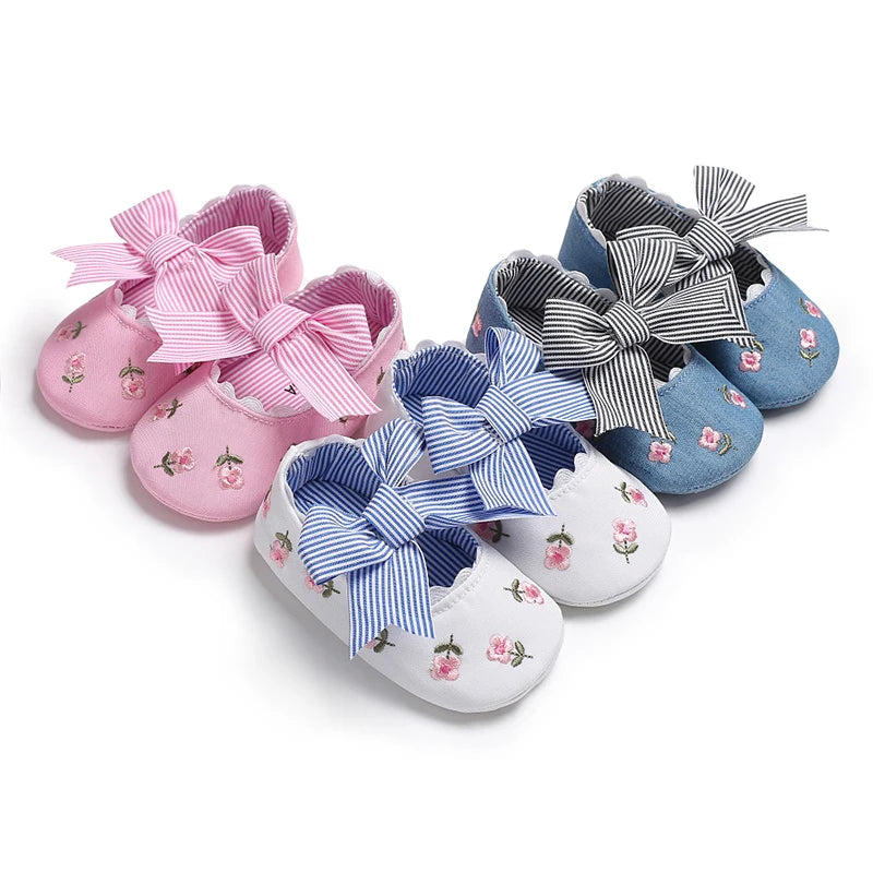 Variety of Girls' Mary Jane Soft Cloth Sole Flats Bow Detail in three colors: pink, white, and denim, featuring adorable bows and flowers.