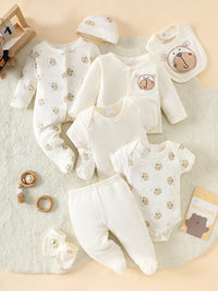 Little Bear beige 8-piece newborn romper set in 100% cotton with bear prints, includes footed sleepers, hat and bib.