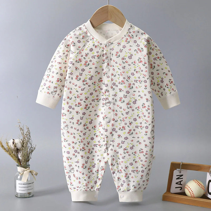 'Little Pansies' baby cotton romper featuring a charming floral print, designed for infants aged 6 to 18 months, offering comfort and convenience with snapped front closure.