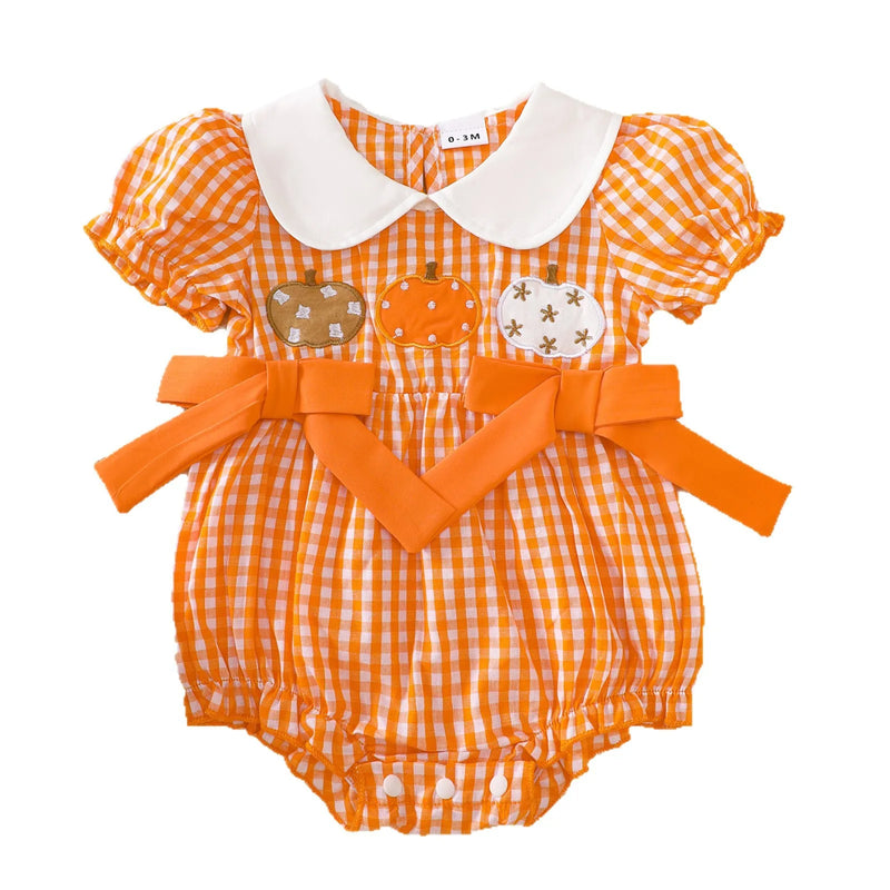 Front view of the Gingham Cutie Baby Pumpkin Romper with bows and embroidered pumpkins, perfect for Halloween.