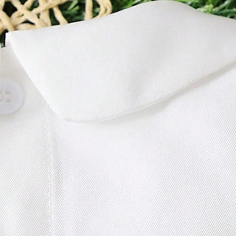 White boys baptism outfit featuring a turn-down Peter Pan collar and combed cotton fabric in Wentworth white.