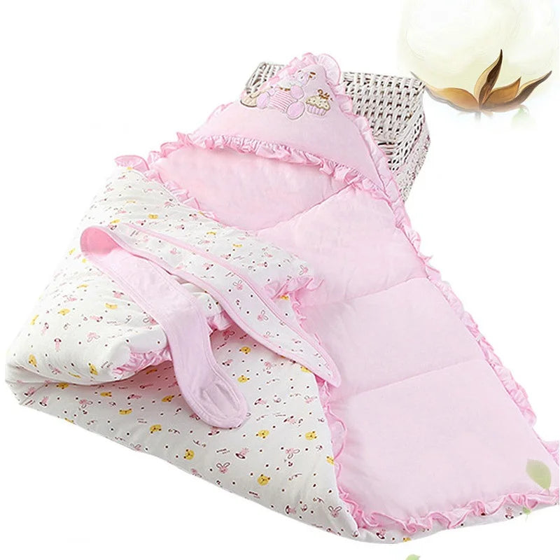 Youthful pink 'Animal Cutie' baby swaddle wrap opened to show soft lining, great for warmth and versatility.