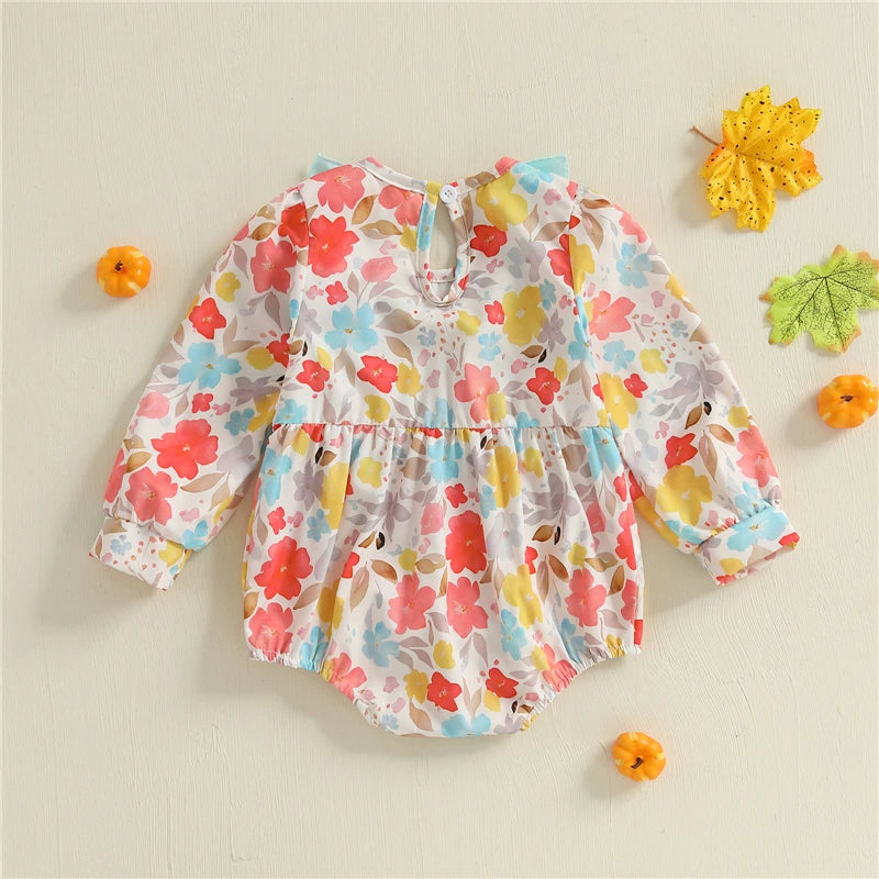 Back view of the Fall Fabulous Pumpkin Embroidered Bubble romper with vibrant floral design, showcasing its stylish and functional features.