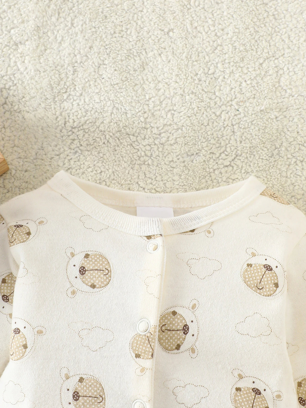 Little Bear beige 8-piece newborn romper set, 100% cotton; cream fabric with bear prints and front snaps.