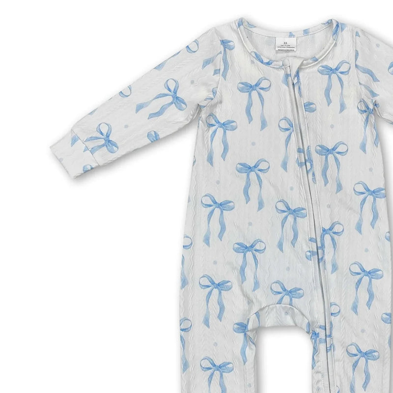 Side view of the Little Blue Bow zippered long sleeve romper in soft blue, designed for comfort and ease for baby outfits.