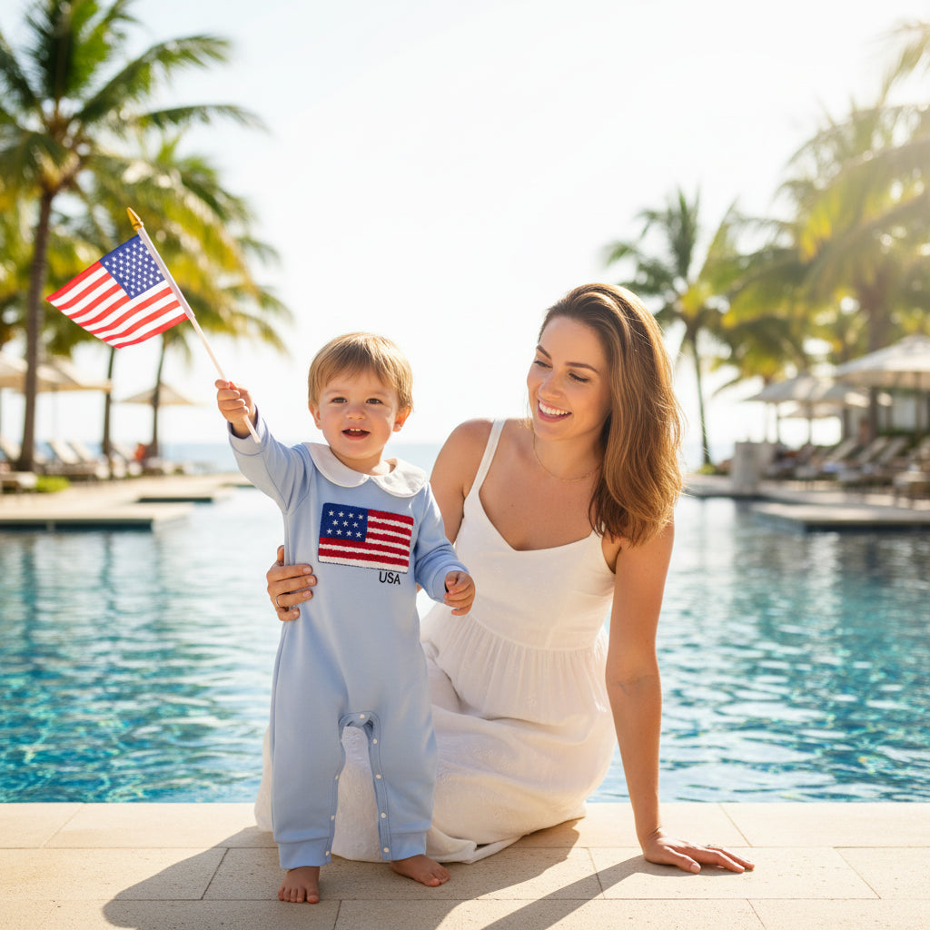 Baby onesie with American flag design on a beige background