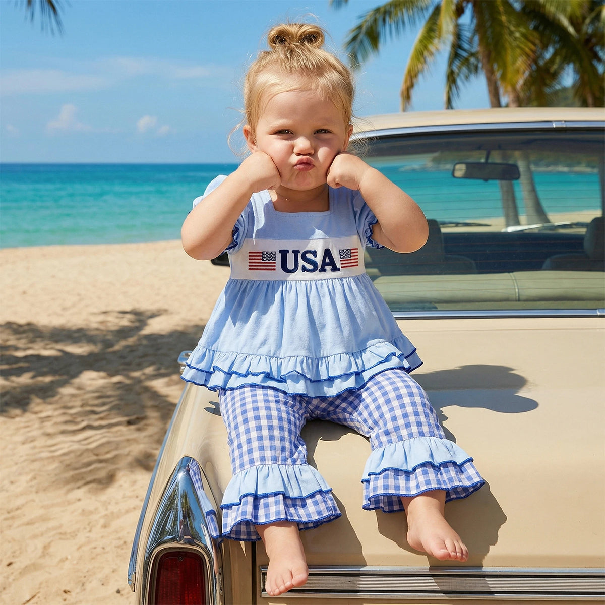 Child sitting on a vintage car by the beach with palm trees in the background