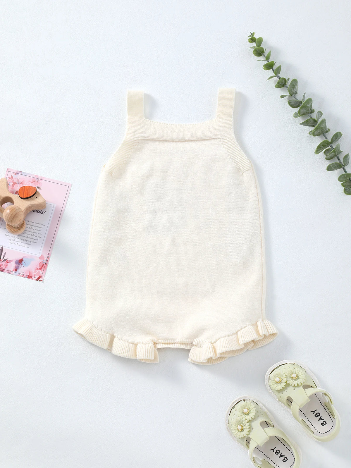 Summer thin frilly floral knit romper for babies, true to size 0-18 months, with wide straps and ruffle hem.