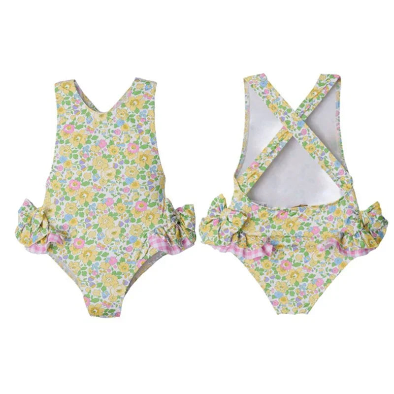 Versatile 'Little Hearts' Ruffled One Piece Girls Summer Swimsuit with a floral print, designed for comfort and style.