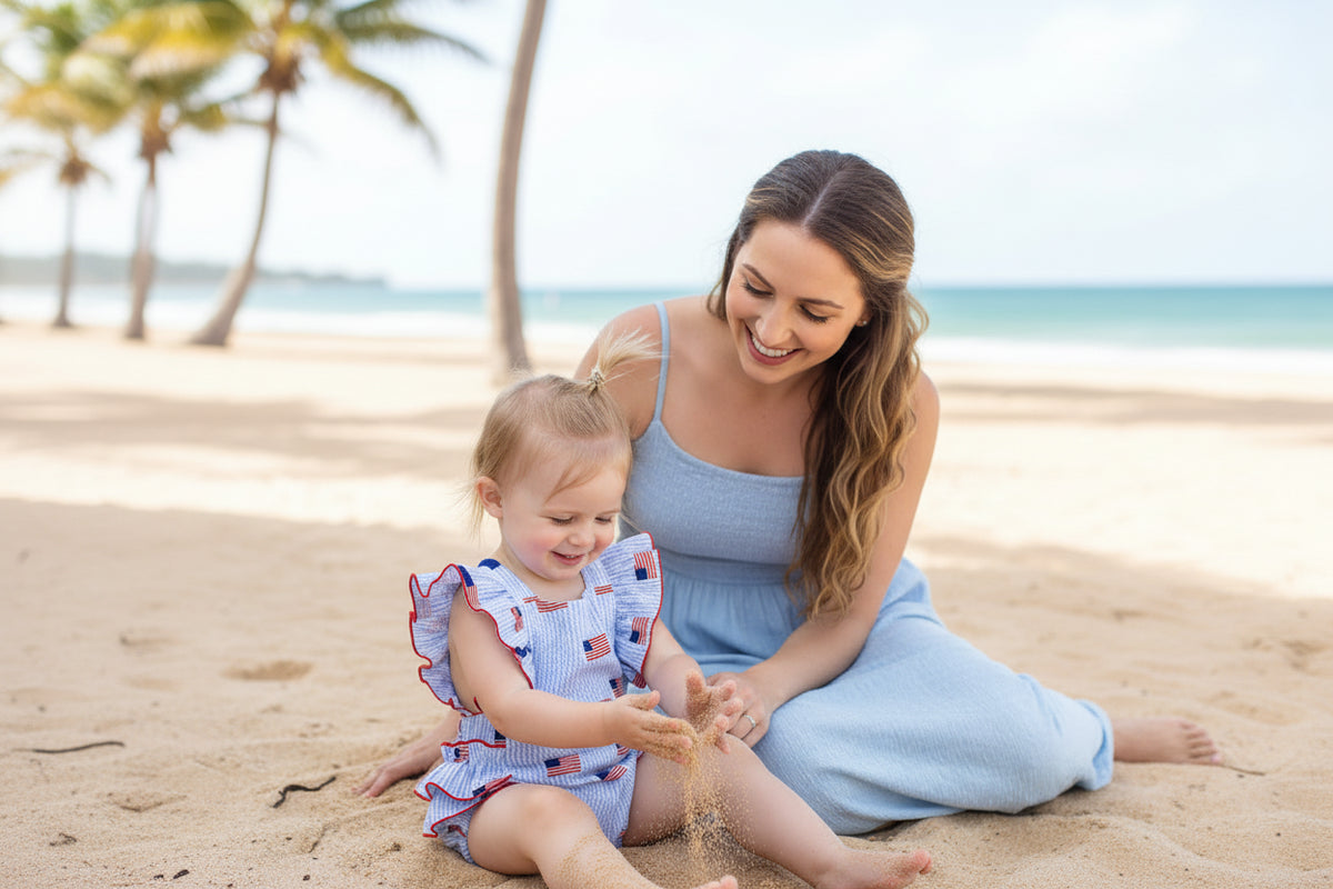 Child wearing a patriotic romper with ruffles outdoors