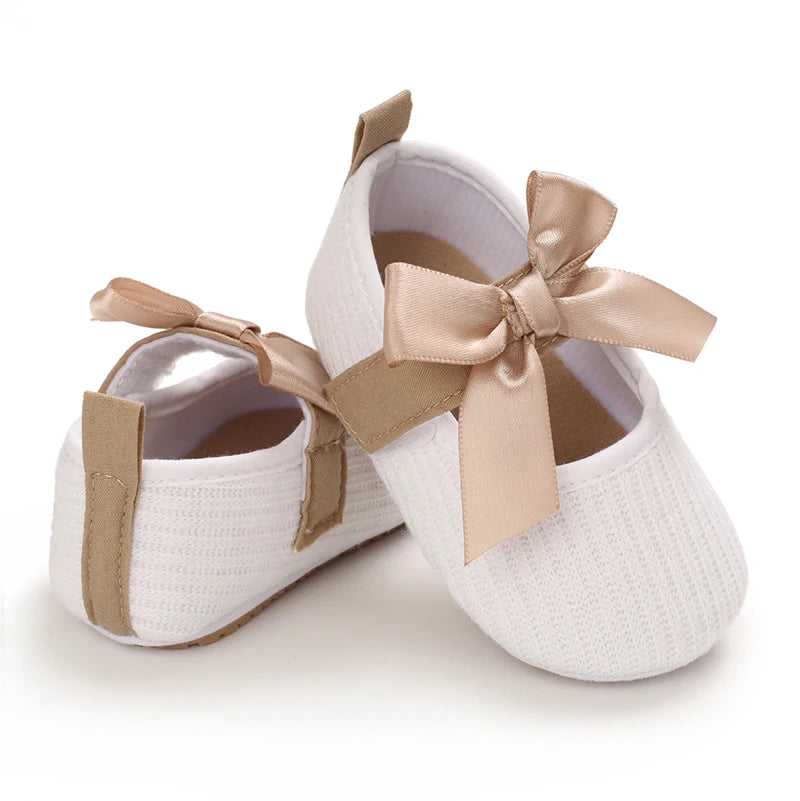 Baby Jane Satin Bow Baby Shoes in white, featuring a stylish satin bow and soft fabric perfect for infants.