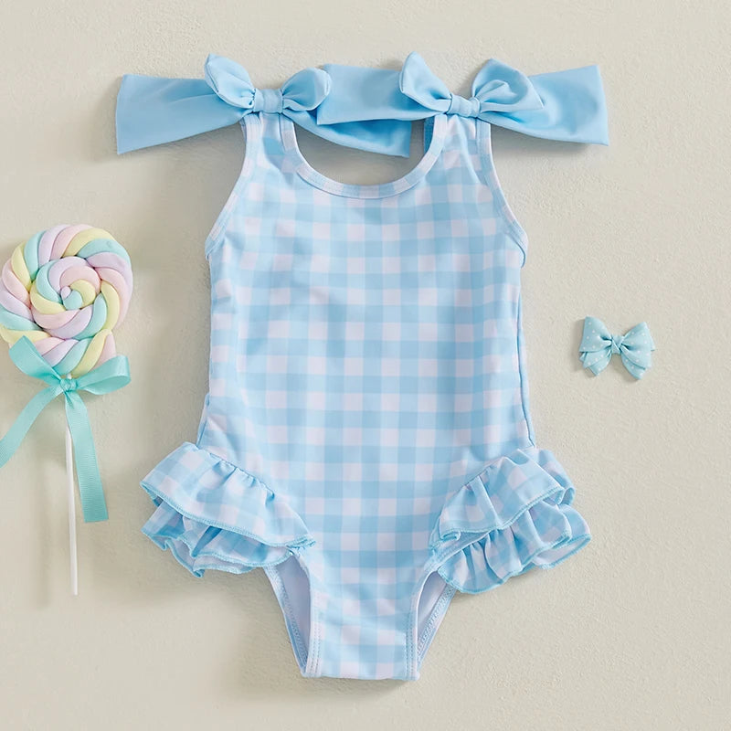 Cute In Checks cute swimsuit for kids in ocean blue with bows and ruffles, perfect for beach or pool days.