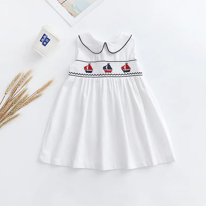Close-up of the luxurious cotton blend fabric of the Set Sail Little Girl's Party Dress.