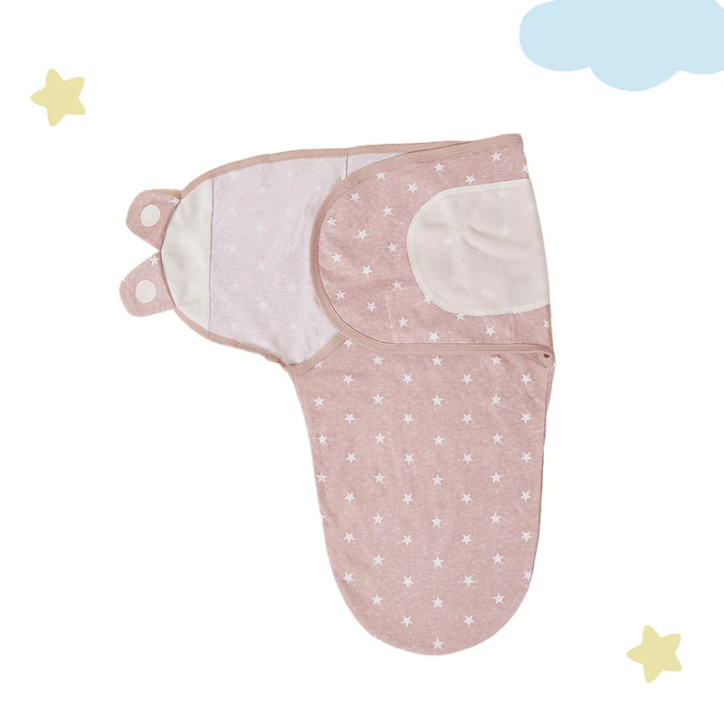 Cozy Baby Swaddle in a soft pink color with a practical design and star patterns, ideal for safe sleeping.