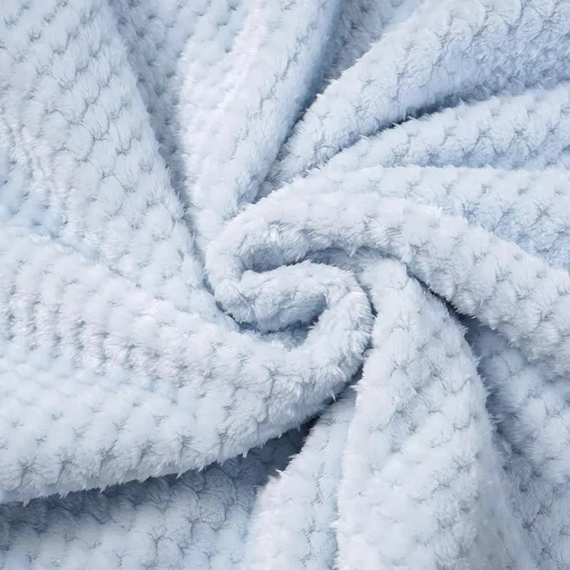 Soft light-blue plush waffle-knit baby blanket texture from a 2-piece set for babies and toddlers