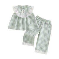 Green gingham eyelet and checks two-piece pant set for little girls with white lace ruffle top and lace-trimmed cuffs.