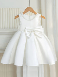 Taylor Elegant Beaded Formal Party Dress for girls ages 2–7, knee-length white gown with beaded neckline and bow.