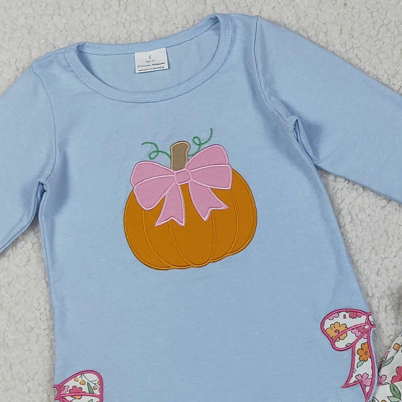 Close-up of the embroidered pumpkin with a pink bow on the Pumpkin Fleurs Baby Girls' Embroidered Skort Outfit, perfect for autumn-themed occasions.